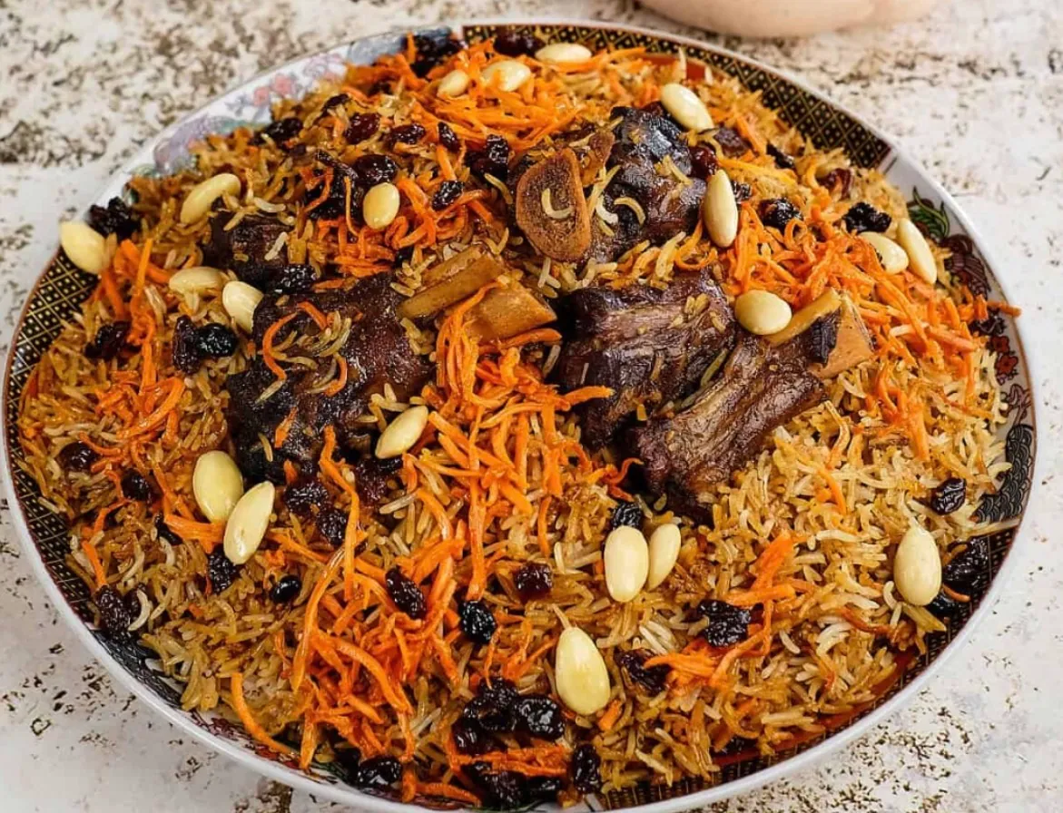 A platter of Kabuli palaw — rice with lamb, shredded carrots, raisins and almonds